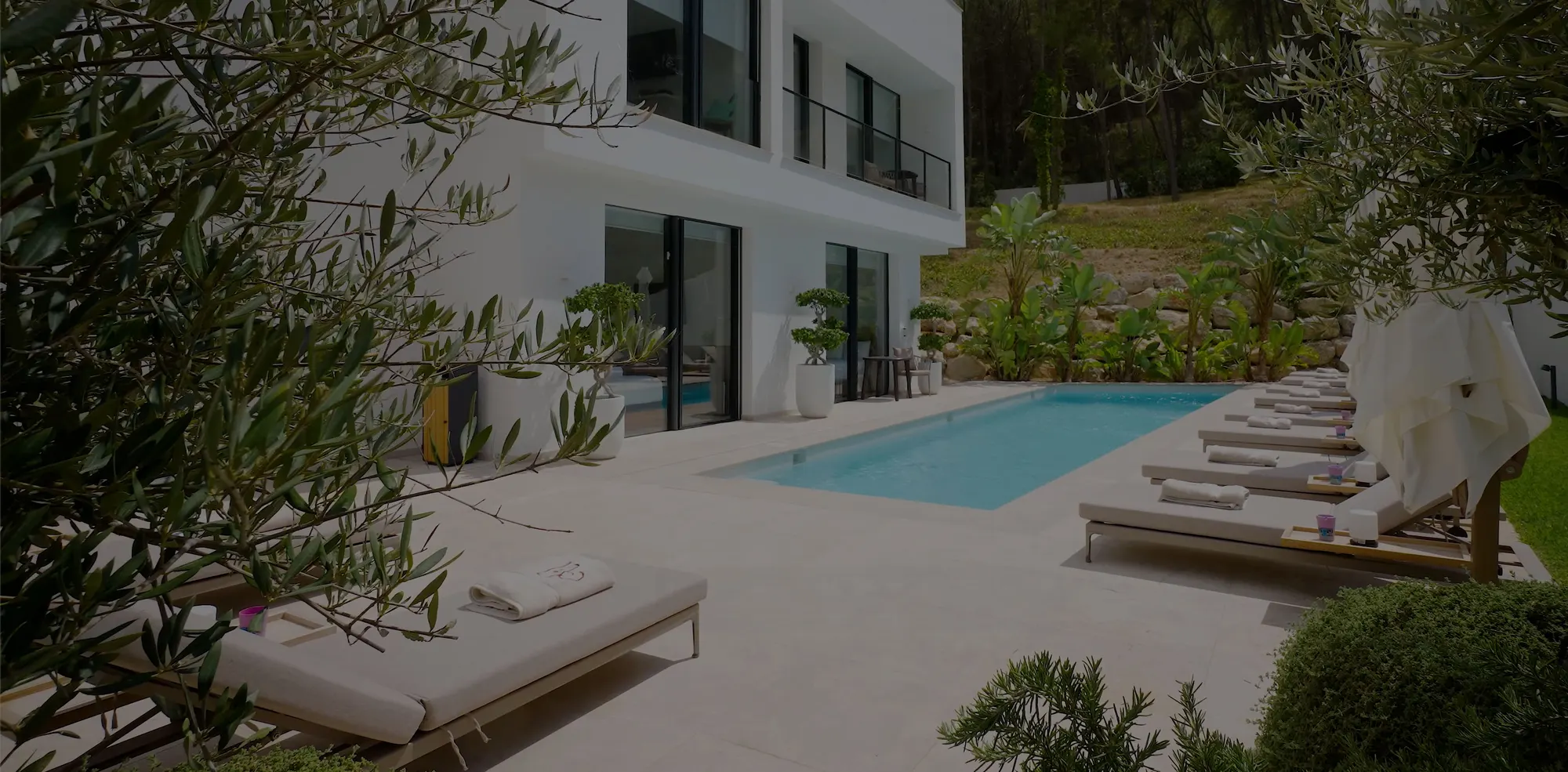White villa with pool and garden