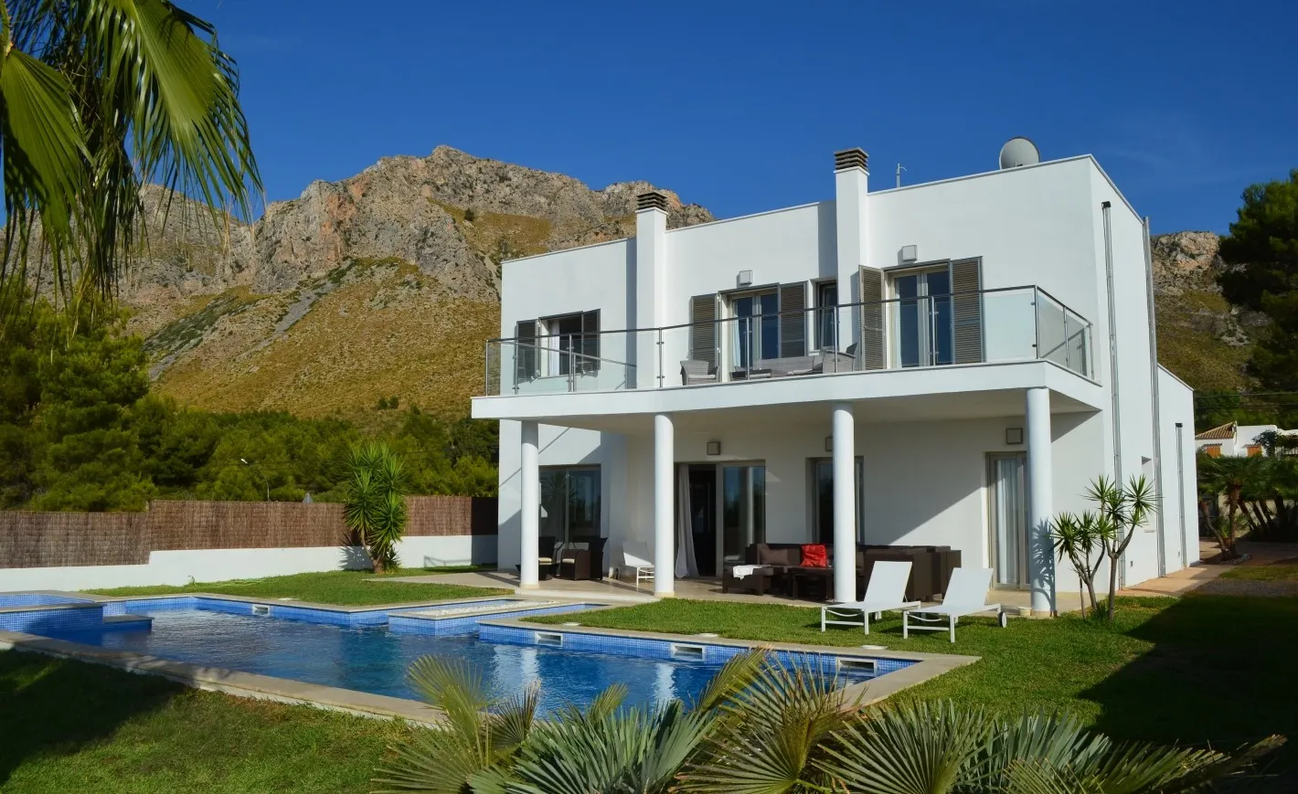 White villa with pool in Betlem, a completed Palmer & Partners project