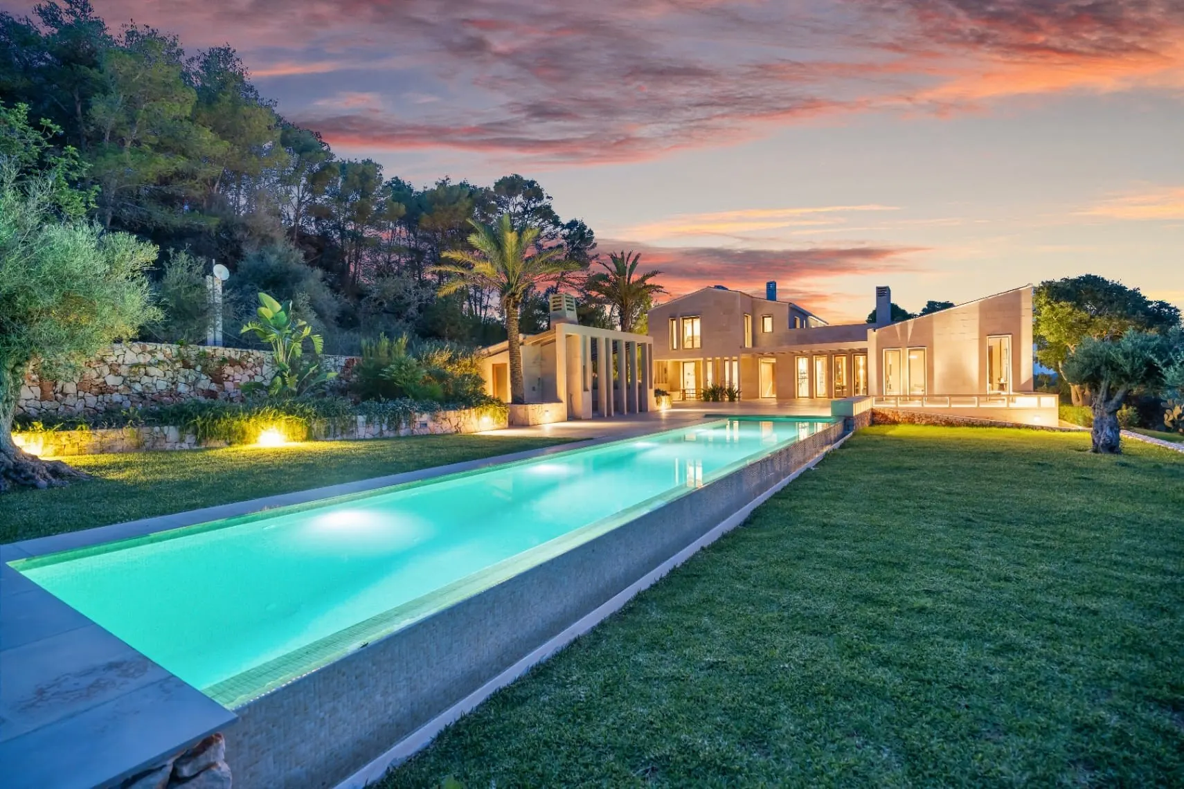 Villa with a long pool at dusk in Es Carritxó, Mallorca